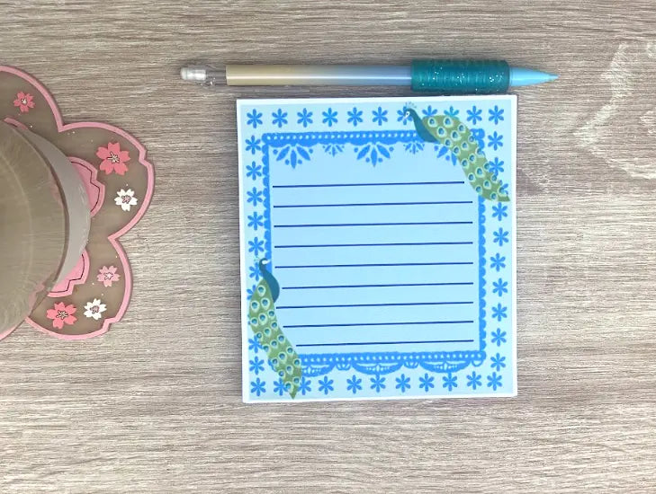 Peacocks Memo Pad, 4.5 by 5.5 inch, Blue background, dark blue border with dark blue flower pattern, one peacock in top right, one in bottom left, lined 50 sheets, not a sticky notepad,  Pyari Paper Shop