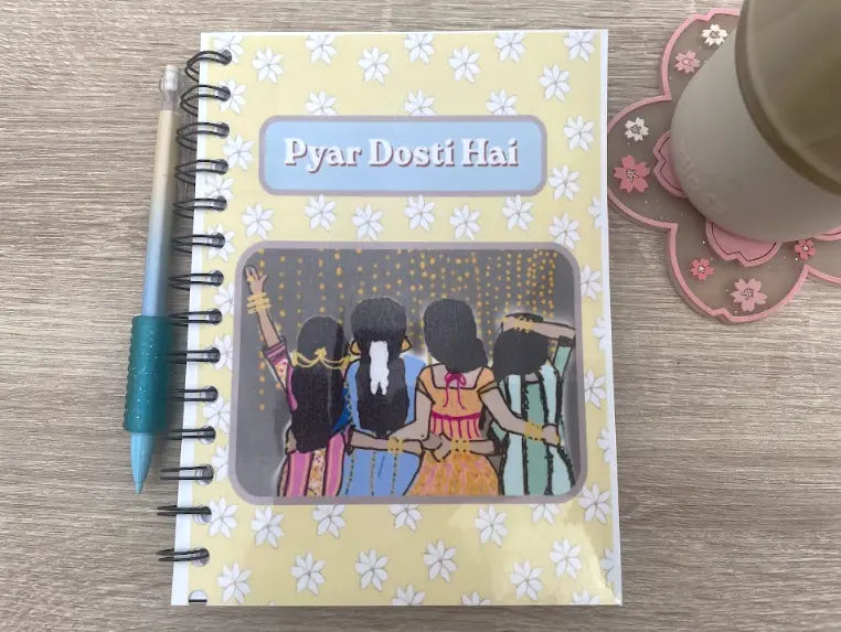 Love is Friendship, 5 by 8 inch notebook journal, yellow with white jasmine flower patter, original art of 4 Indian girls dressed up, celebrates friendship and girlhood, says "Pyar Dosti Hai", Pyari Paper Shop